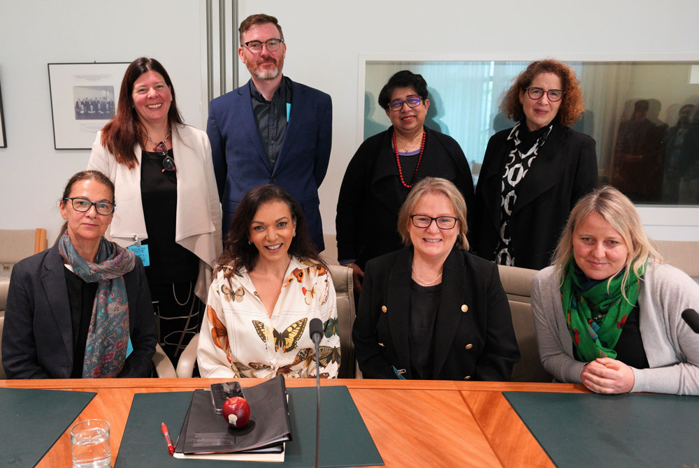 Photograph of Minister for Early Childhood Education Dr Anne Aly with seven members of advisory group at Australian Parliament House in Canberra.