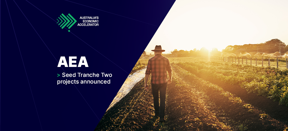 AEA (Australia’s Economic Accelerator) Seed Tranche Two projects announced. In the background, there is a farmer, with his back facing the viewer, walking on a large rural property.