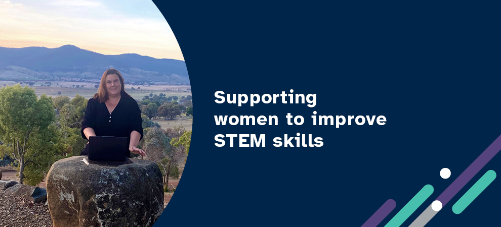 Banner with a woman standing behind a rock in the Australian outback with the slogan, supporting woman to improve STEM skills.