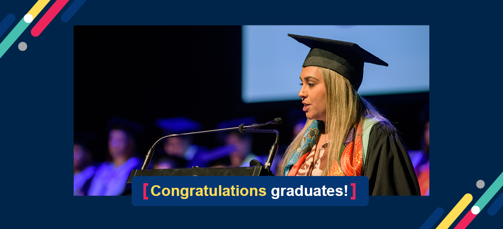 Image of lady standing at a lectern speaking with the wording 'Congratulations Graduates' 