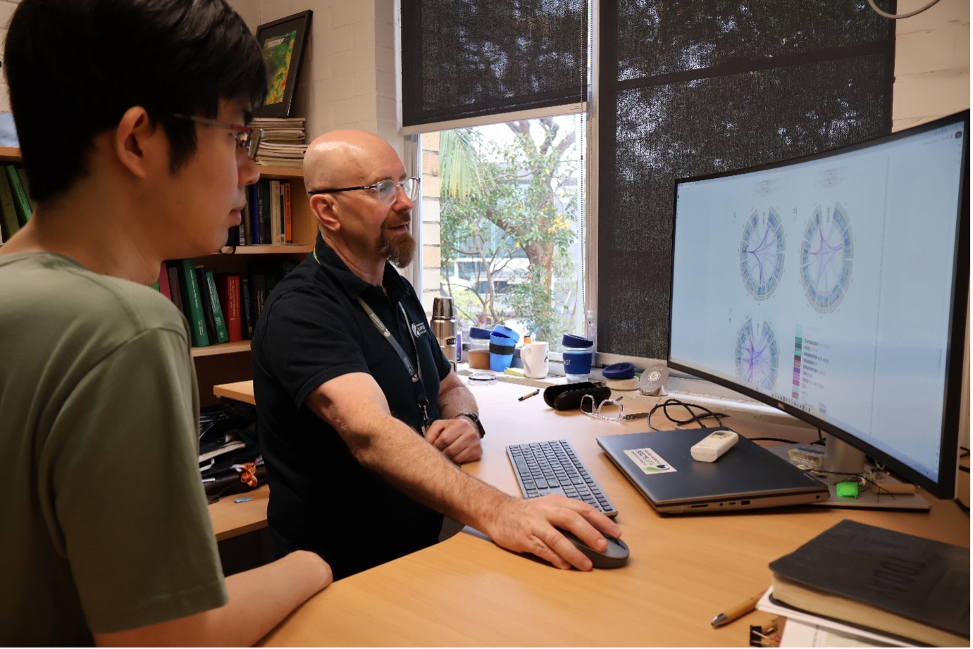 PhD candidate Shunichiro Tomura and Professor Mark Cooper