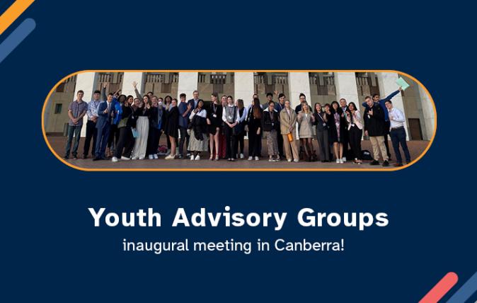 A group of young happy people from the Youth Advisory group standing out the front of the Australian Parliament House