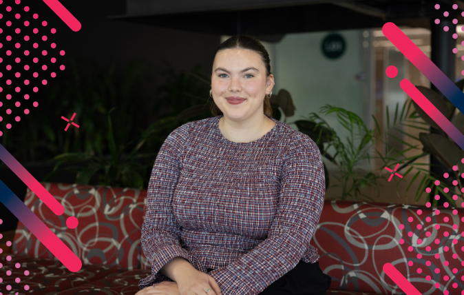 Image of Annie sitting on a chair in a foyer