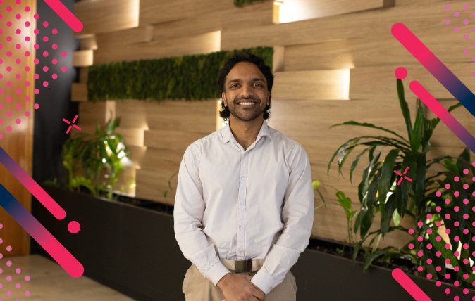 Image of Visun standing in front of a living plant wall