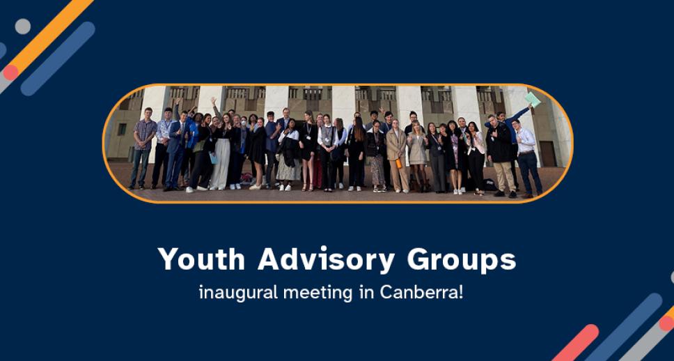 A group of young happy people from the Youth Advisory group standing out the front of the Australian Parliament House