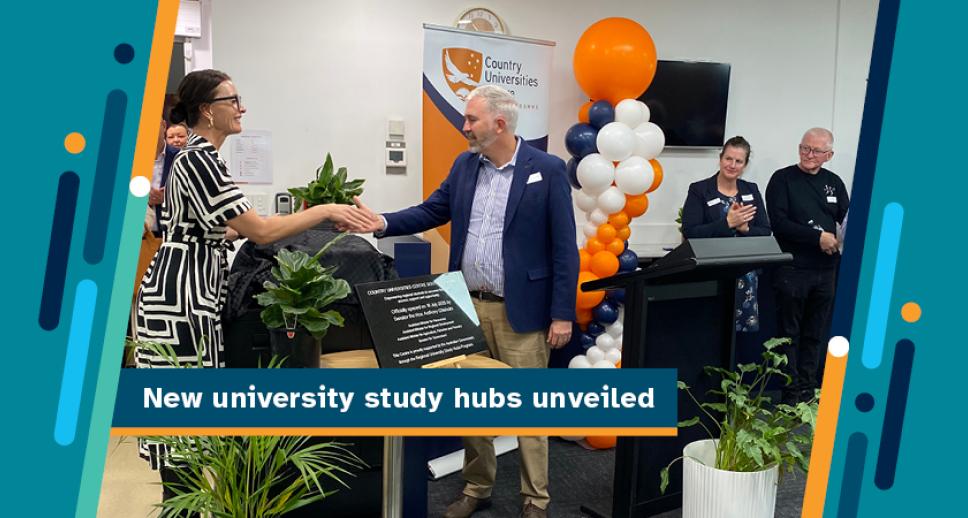 New university study hubs unveiled - Two people shaking hands, smiling and standing in front of a university banner and behind the placard detailing the opening of the Regional University Study Hub being opened.